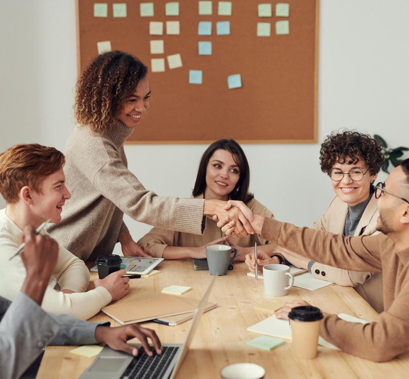 Happy people sitting doing a coaching session